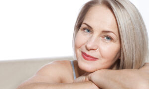 Beautiful mature woman with glowing skin from chemical peel treatment