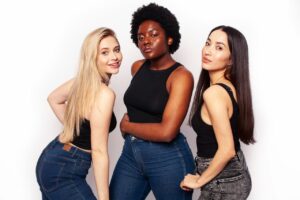 Group of women posing happily after liposuction, showcasing more sculpted and contoured figures