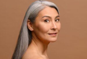 Woman with improved eye appearance after eyelid surgery in Dennis, MA