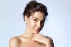 Woman with smooth, healthy skin representing results from chemical peels and microneedling treatments.
