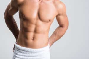 Male chest after gynecomastia surgery showing a flatter, more defined chest contour.