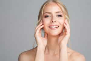 Woman smiling with youthful-looking facelift results.